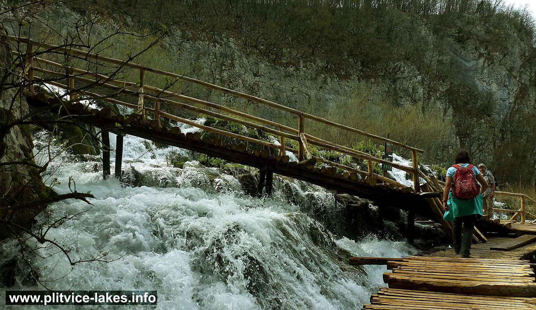 Crossing waterfalls at Plitvice Lakes