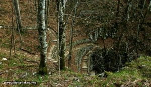 Approach to Šupljara cave via elevated wooded path, Plitvice Lakes